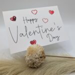 Valentinstagskarte mit glänzenden Herzen